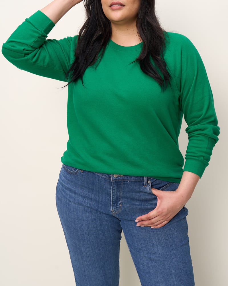 Front of a model wearing a size 2X The Raglan Sweatshirt in Kelly Green by The Standard Stitch. | dia_product_style_image_id:348039